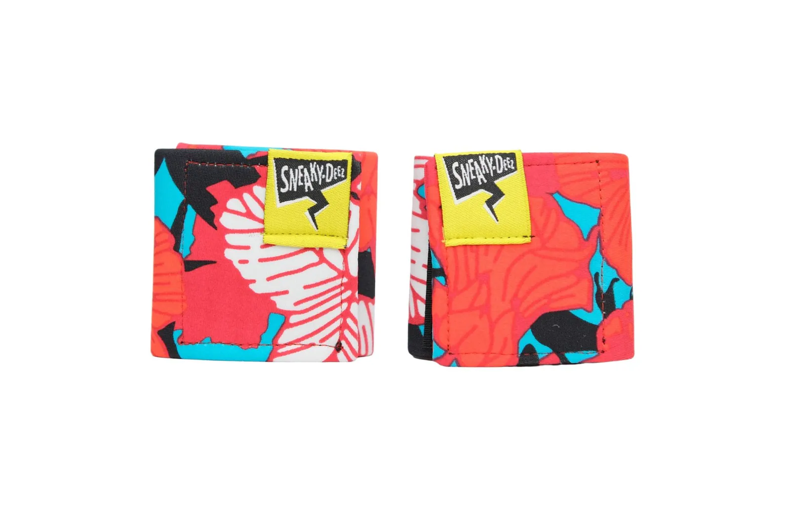 A pair of SneakyDeez wrist wraps in a bold red, coral, turquoise and white floral print on a white background