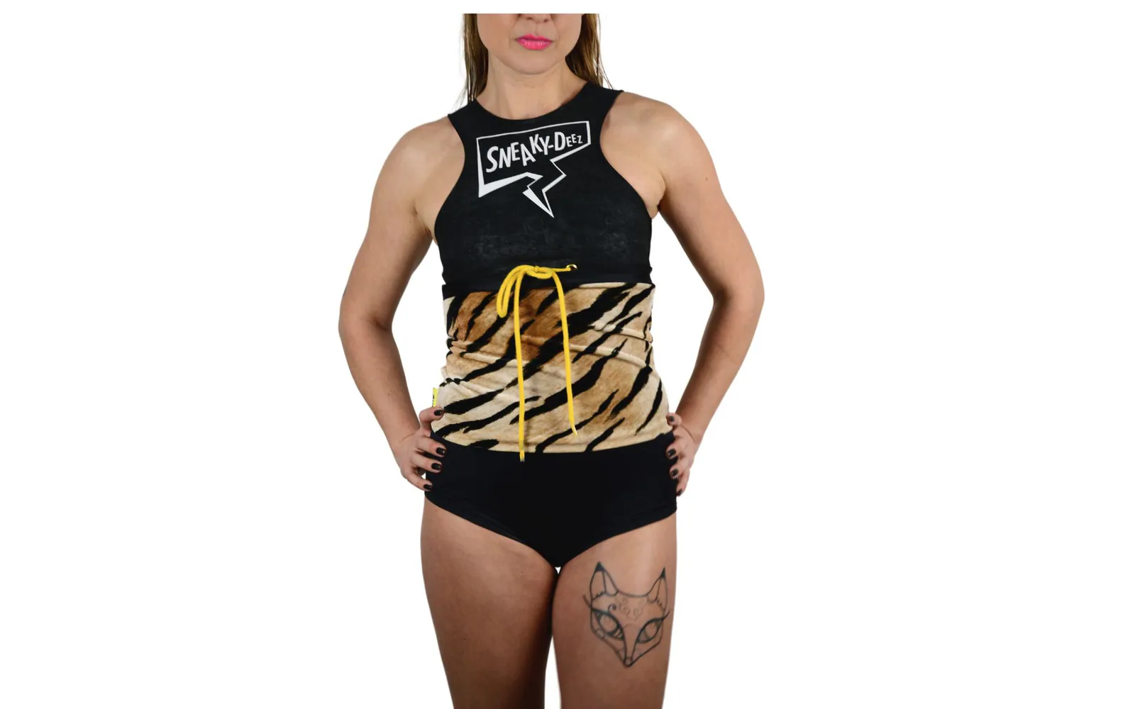 Woman in a black SneakyDeez crop top and black briefs wearing a tiger-print waist warmer laced at the front with a yellow cord, standing against a white background